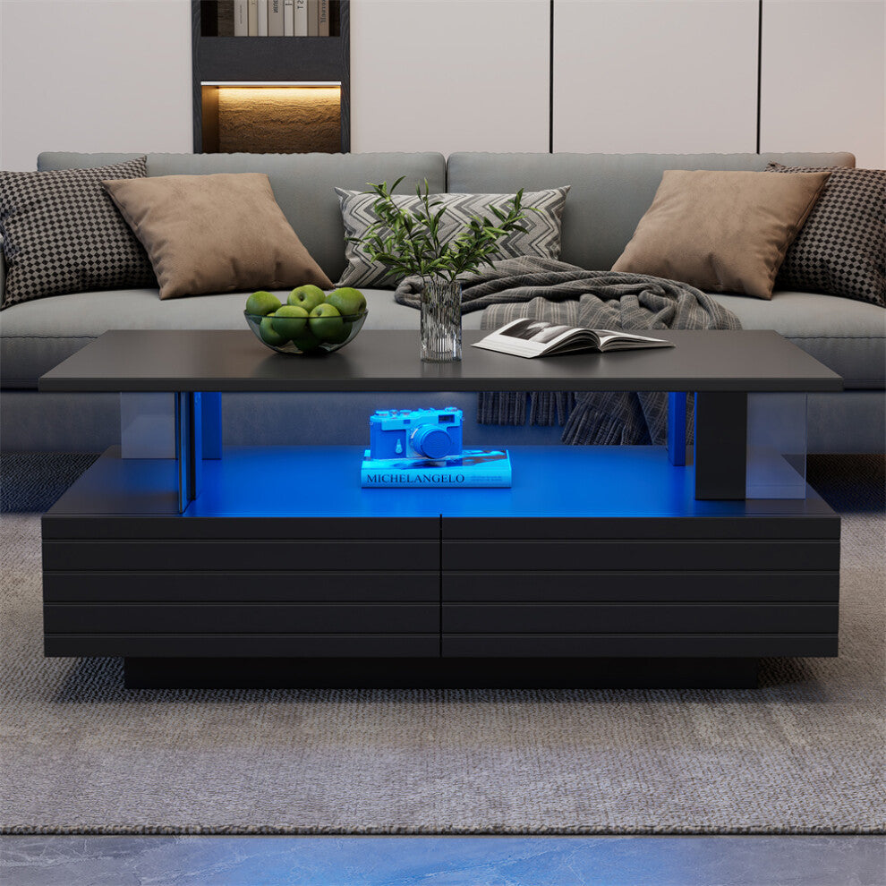 Black coffee table with storage, blue LED display shelf and ribbed drawers in front of a grey sofa