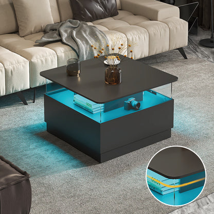 Black square LED coffee table glowing blue with acrylic display shelf in front of a cream sofa