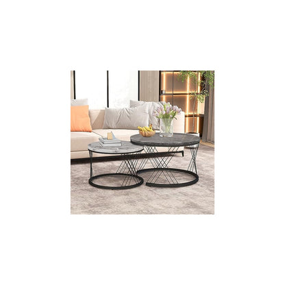 Charcoal and white marble-effect round coffee table set with peach cushions and fruit bowl