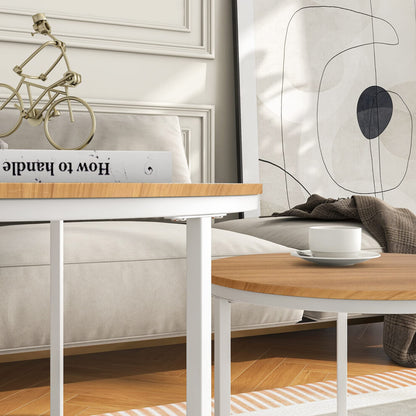 Close-up of light oak-effect round coffee table top and slim white metal legs