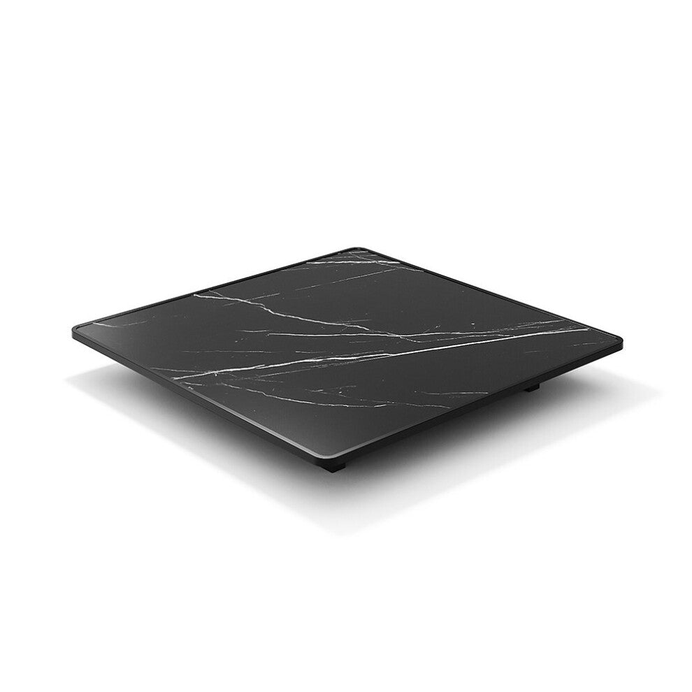 Folding square coffee table folded flat showing the black marble-effect top with white veining