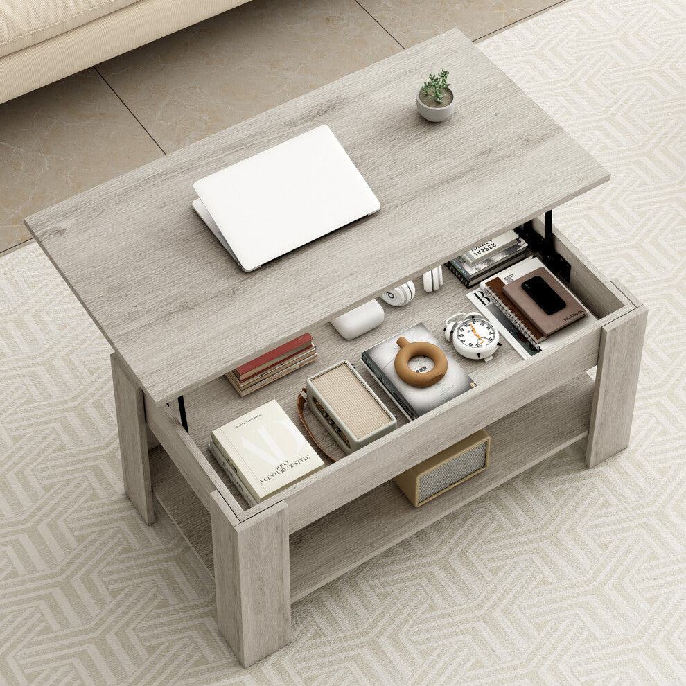 Top view of grey coffee table storage compartment filled with books, clock and notebooks