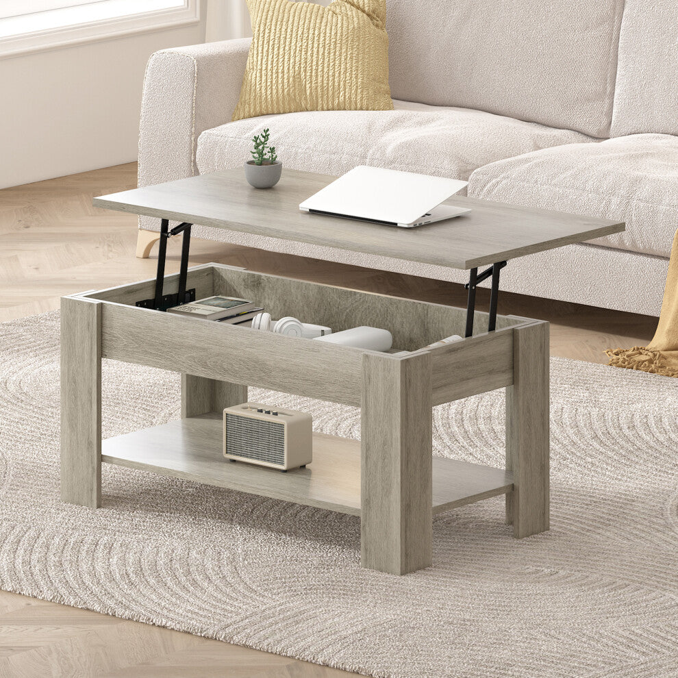 Grey coffee table with storage and lift up top raised with a laptop in front of a cream sofa