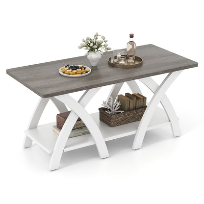 Grey top white legs coffee table styled with plant, tray and baskets on the lower shelf