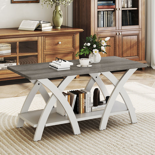 Grey and white rectangular coffee table with crossing legs and open shelf in a traditional living room