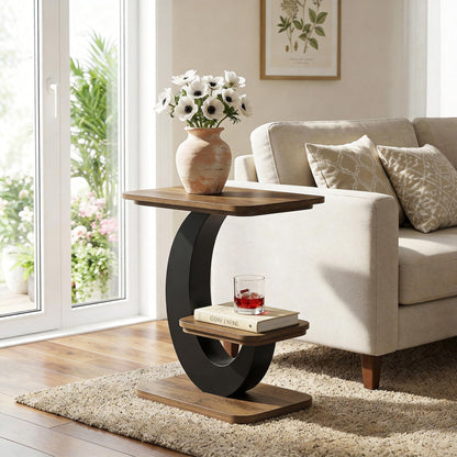 Industrial side table with black arched frame and wood-grain shelves beside a cream sofa