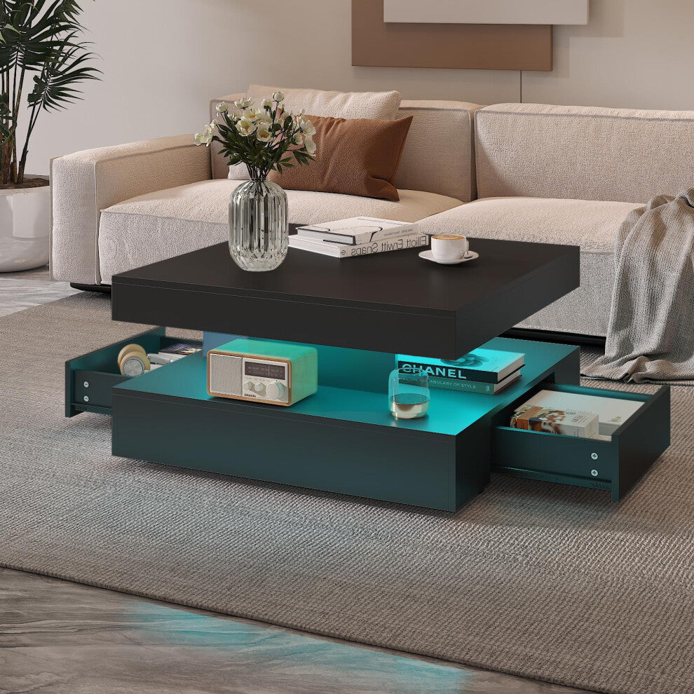 Large black square coffee table with teal LED-lit shelf and both drawers open in front of a beige sofa