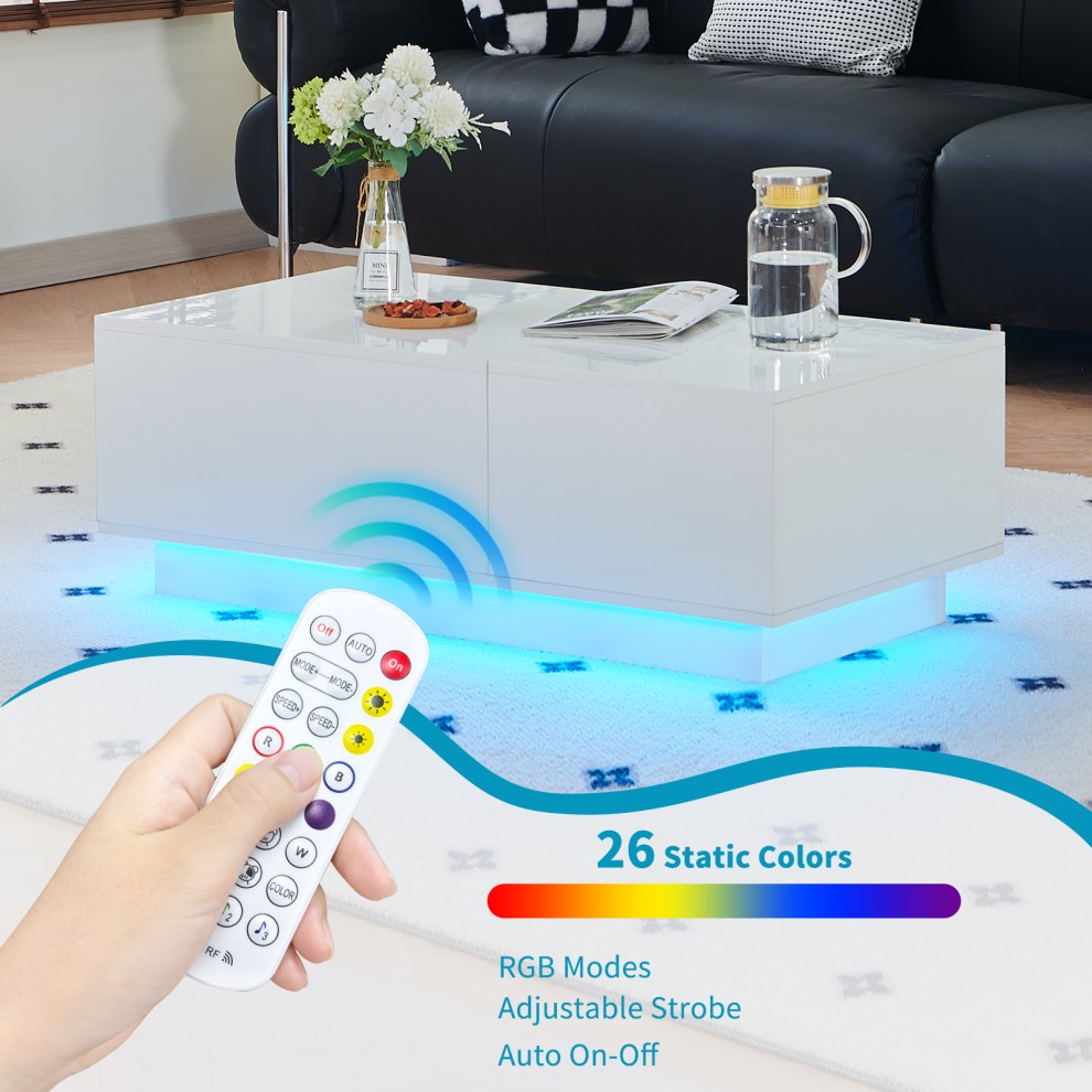 Remote control changing the colours of a white gloss LED coffee table
