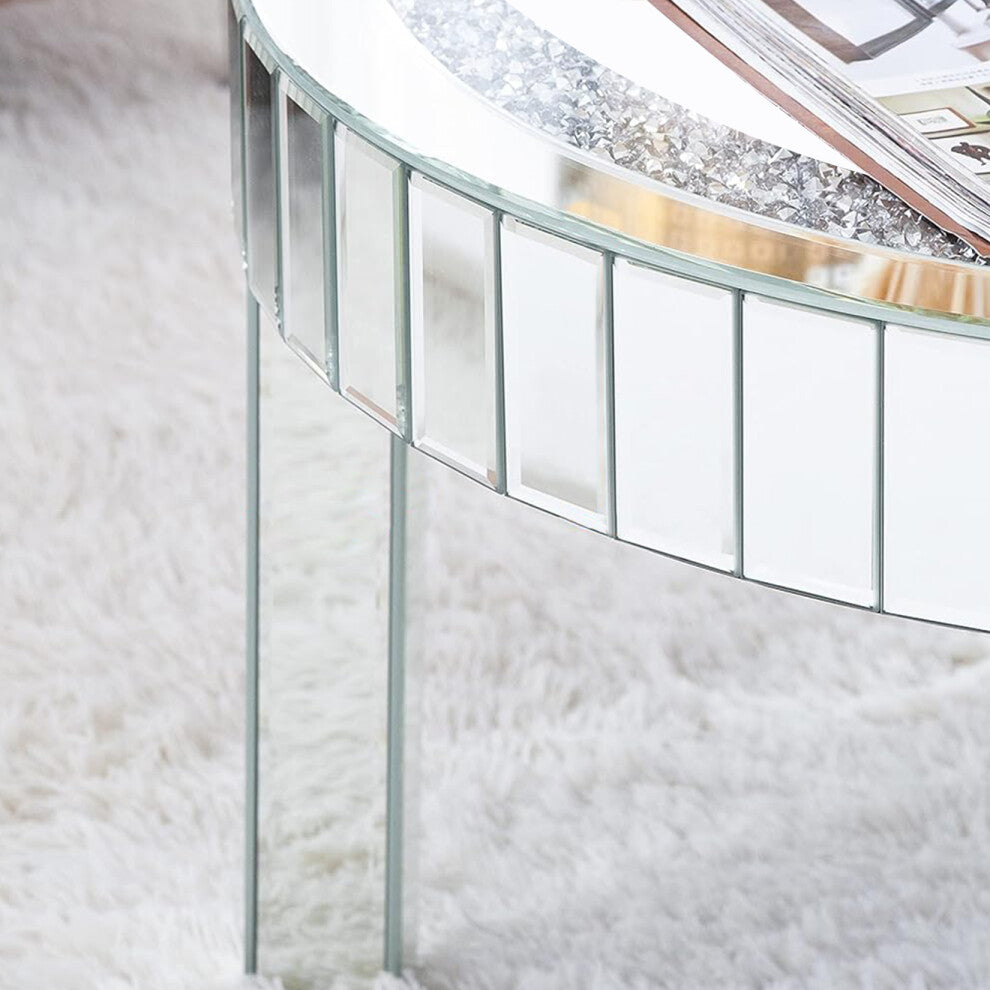 Close-up of bevelled mirror apron panels and crushed crystal ring on the round mirrored coffee table