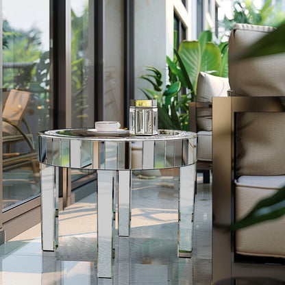Round mirrored glass table with crystal inlay holding a teacup and lantern in a bright sunroom