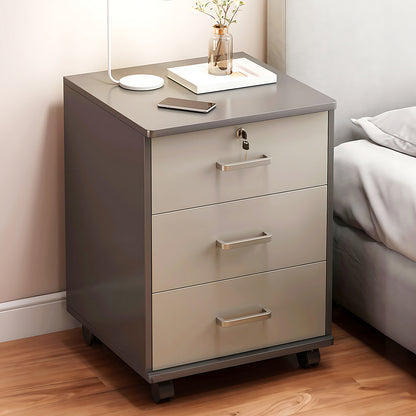 Mobile bedside cabinet with phone charger on top in a bedroom