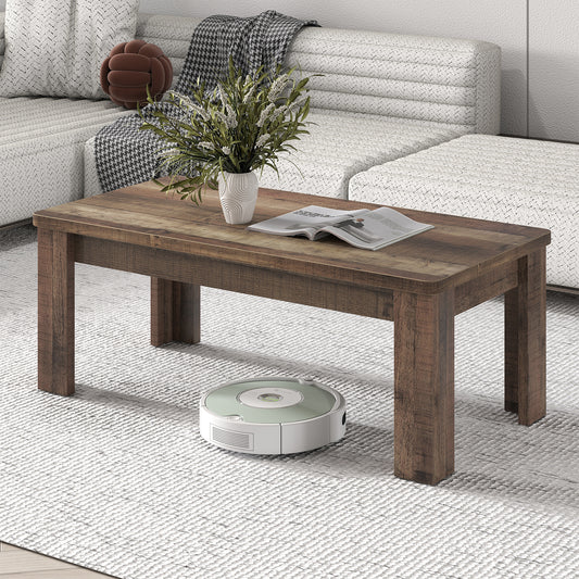 Modern rectangular coffee table in rustic wood effect styled with a plant and magazine in a grey living room