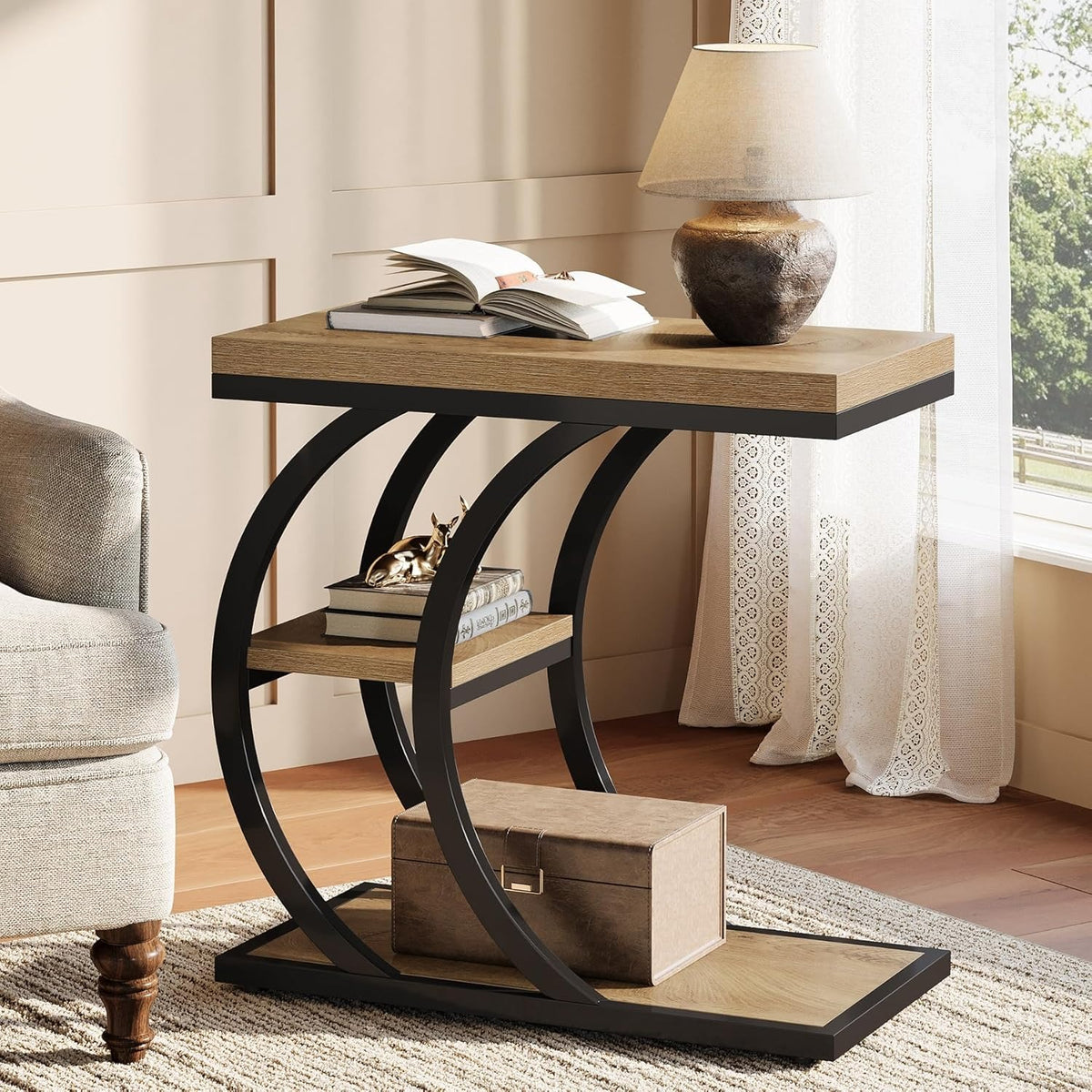 Narrow sofa side table in a reading corner with a lamp, books and a storage box