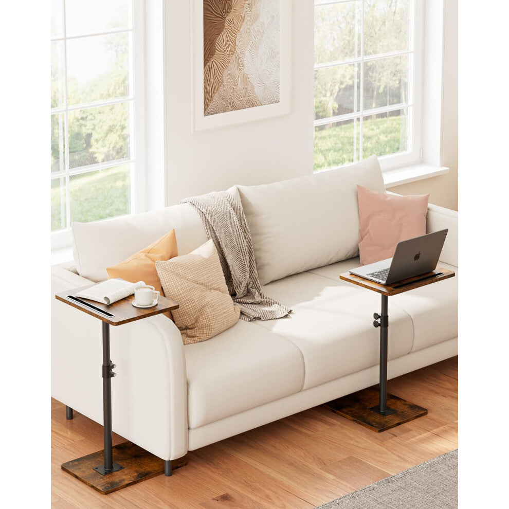 Pair of rustic brown adjustable sofa side tables at each end of a cream sofa