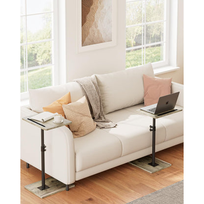 Pair of small grey wood coffee tables either side of a sofa in a living room