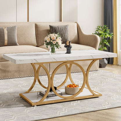 Rectangle marble coffee table with white faux marble top and gold circle frame in front of a beige sofa