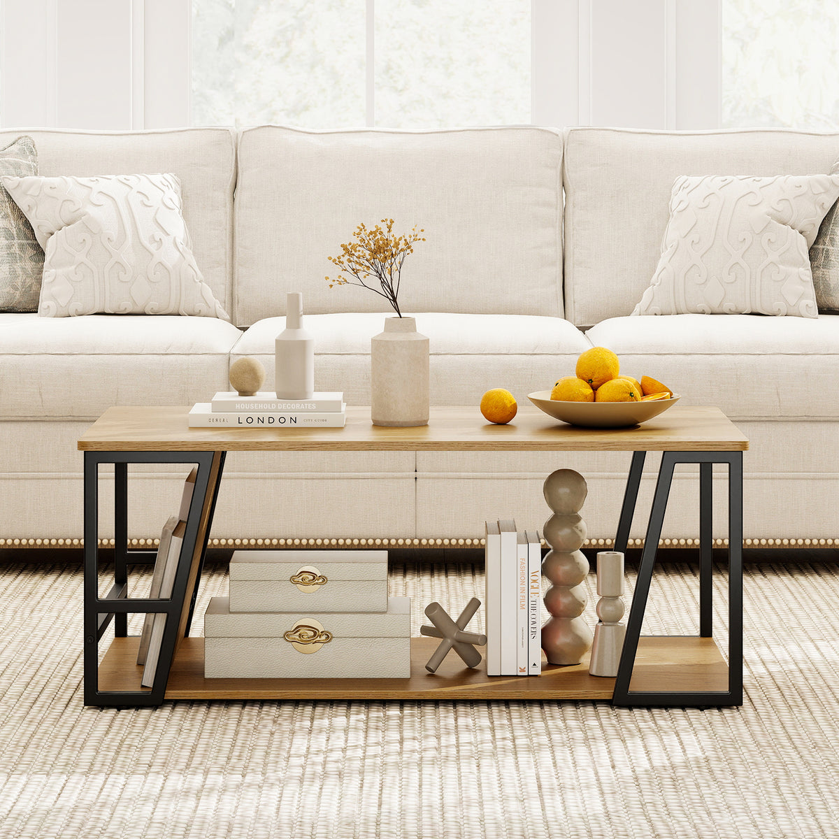 Rectangular coffee table with storage shelf, oak-tone top and black angled metal frame in front of a cream sofa