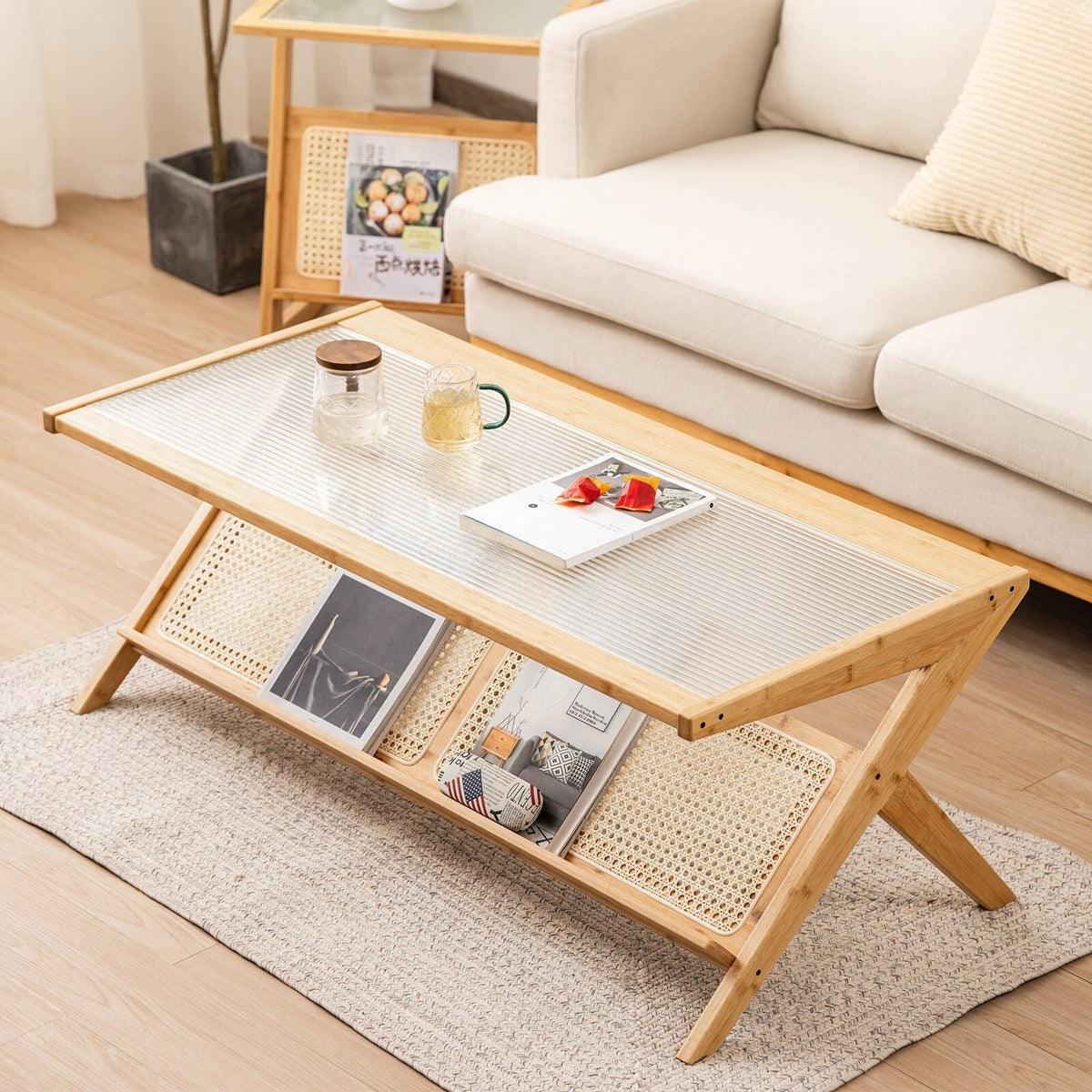 Rectangular glass coffee table with bamboo frame and reeded glass top in a cream living room