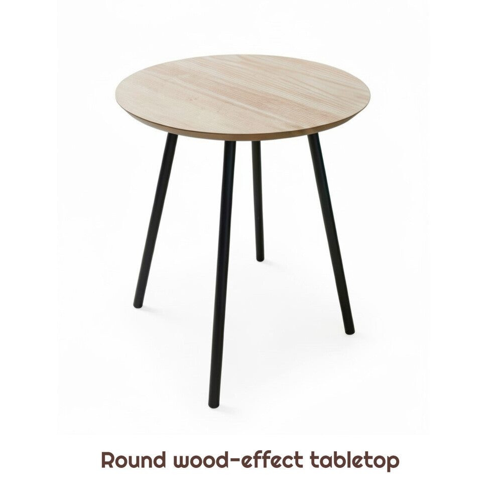 Round wood-effect side table with four black splayed legs on a white background