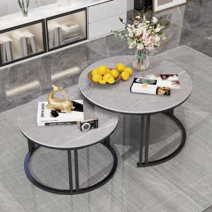Set of 2 round nesting coffee tables with grey marble-effect tops styled in a modern living room