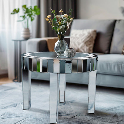 60cm silver mirrored round coffee table with bevelled mirror apron in front of a grey sofa