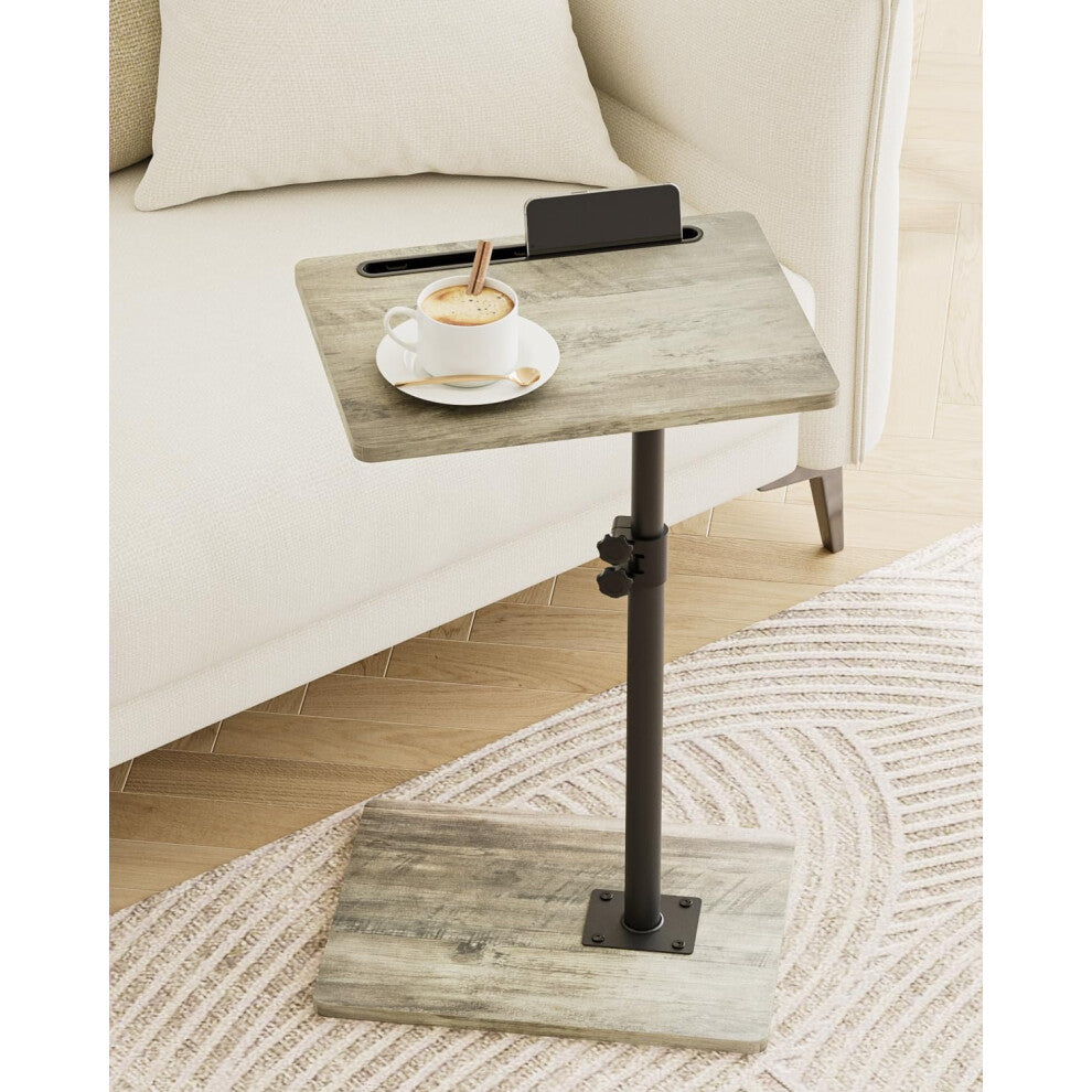 Small rectangle coffee table in grey wood effect beside a cream sofa holding a cup of coffee