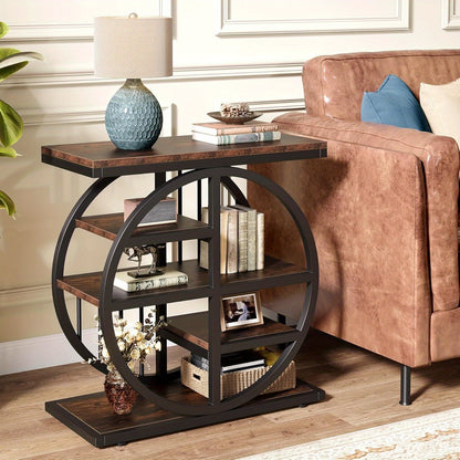 Tall narrow side table with round black frame and shelves beside a tan leather sofa