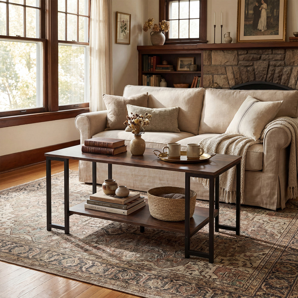 Two-tier rectangular coffee table with rustic brown top styled in front of a cream sofa