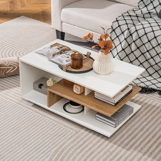 White coffee table with L-shaped oak-tone shelf styled with books, tray and vase on a striped rug