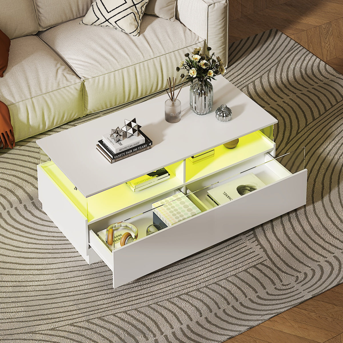 White high gloss coffee table with open drawer and yellow LED lights in the compartments