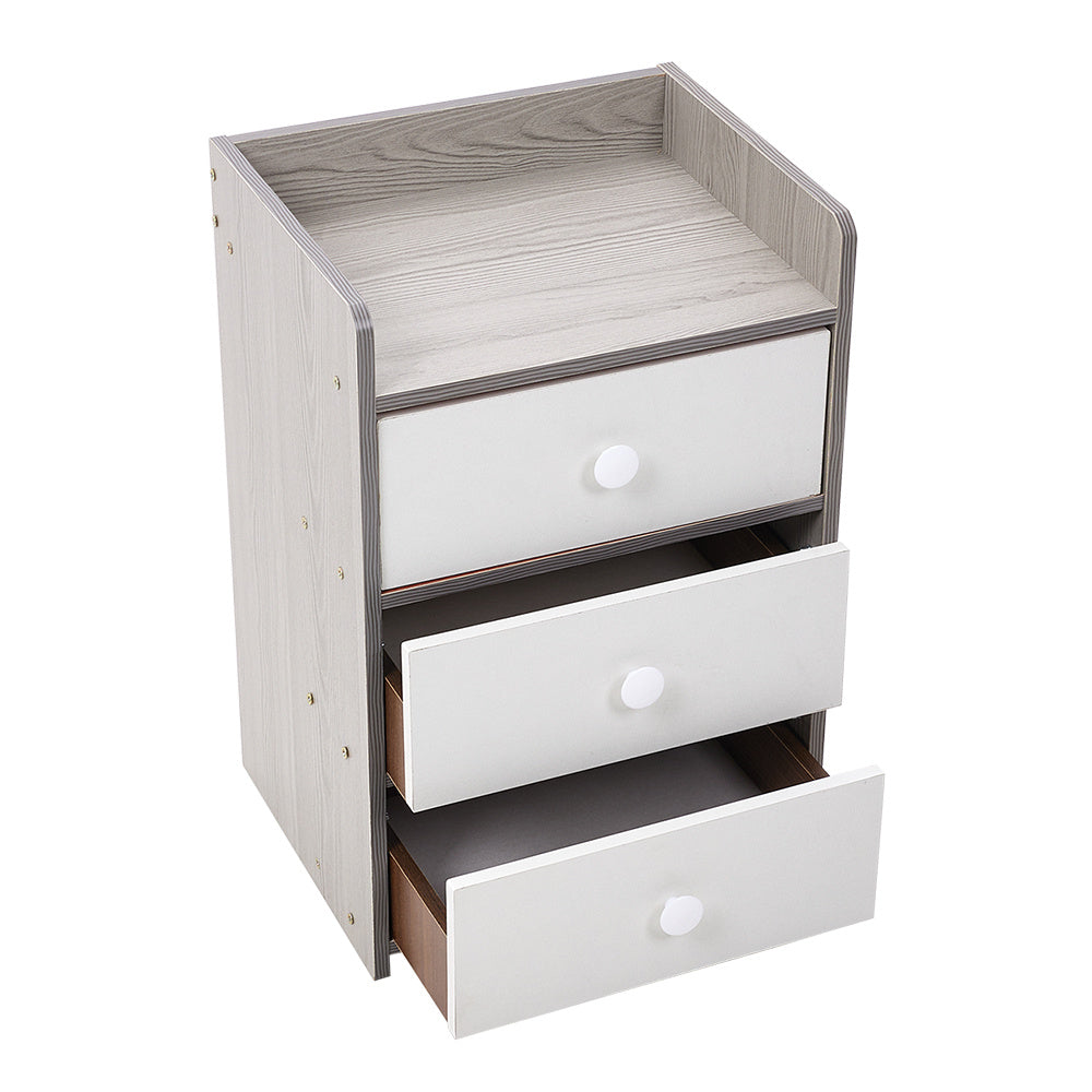 White-fronted bedside cabinet with two drawers pulled open