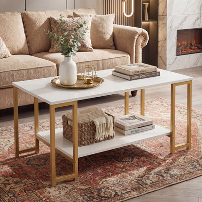 Rectangular white coffee table with gold frame and woven basket on lower shelf on a red patterned rug