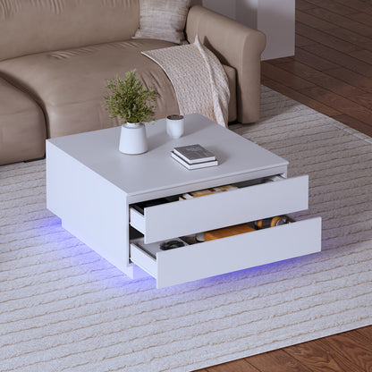 White square coffee table with two front drawers open and blue LED underglow beside a beige leather sofa